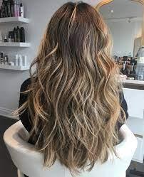 A wavy long layered brown hair with highlights