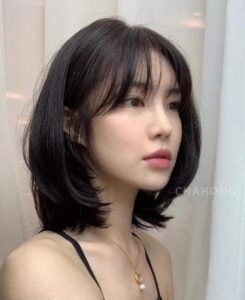 Blunt lob with wispy curtain bangs asian girl