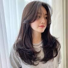 C-curl medium hair with curtain bangs