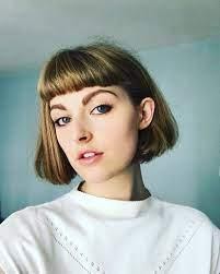 Edgy look in a layered chin-length bob with micro bangs