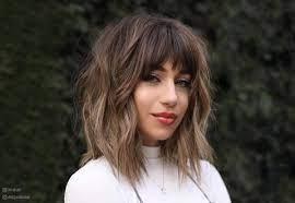 Gorgeous girl in a shaggy layered bob with full blunt bangs