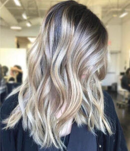 Root blur balayage hair look that makes an ombre effect on medium length hair