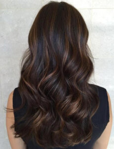 A go-to natural-looking subtle balayage highlight on long hair