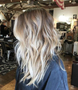 Rooted bright bronde balayage in medium length hair