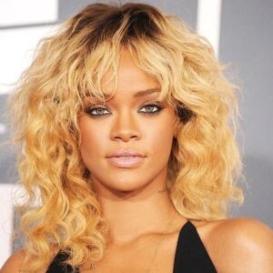 Rhianna on her polished blonde curls