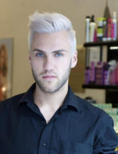 Blue-eyed men in a Black polo shirt with white lightning hair