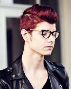 Deep Red hair on a man with glasses and black jacket