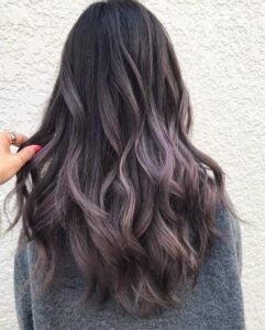 Wavy hair in a ravishing smoke purple ombre