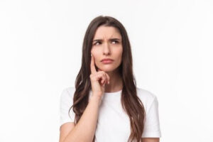 A brown-haired girl in deep thoughts