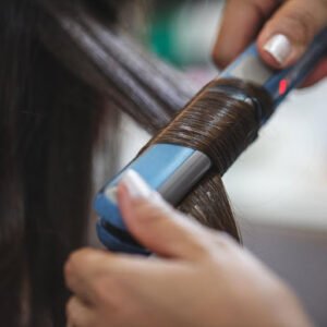 A flat iron used in the hair