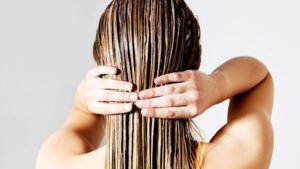 Girl putting products on her hair