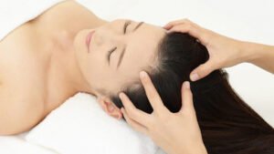 A girl having a scalp massage